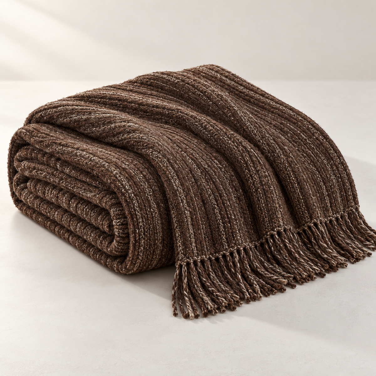 Celestia Sculpted Bed Throw, complete set on a quiet studio surface